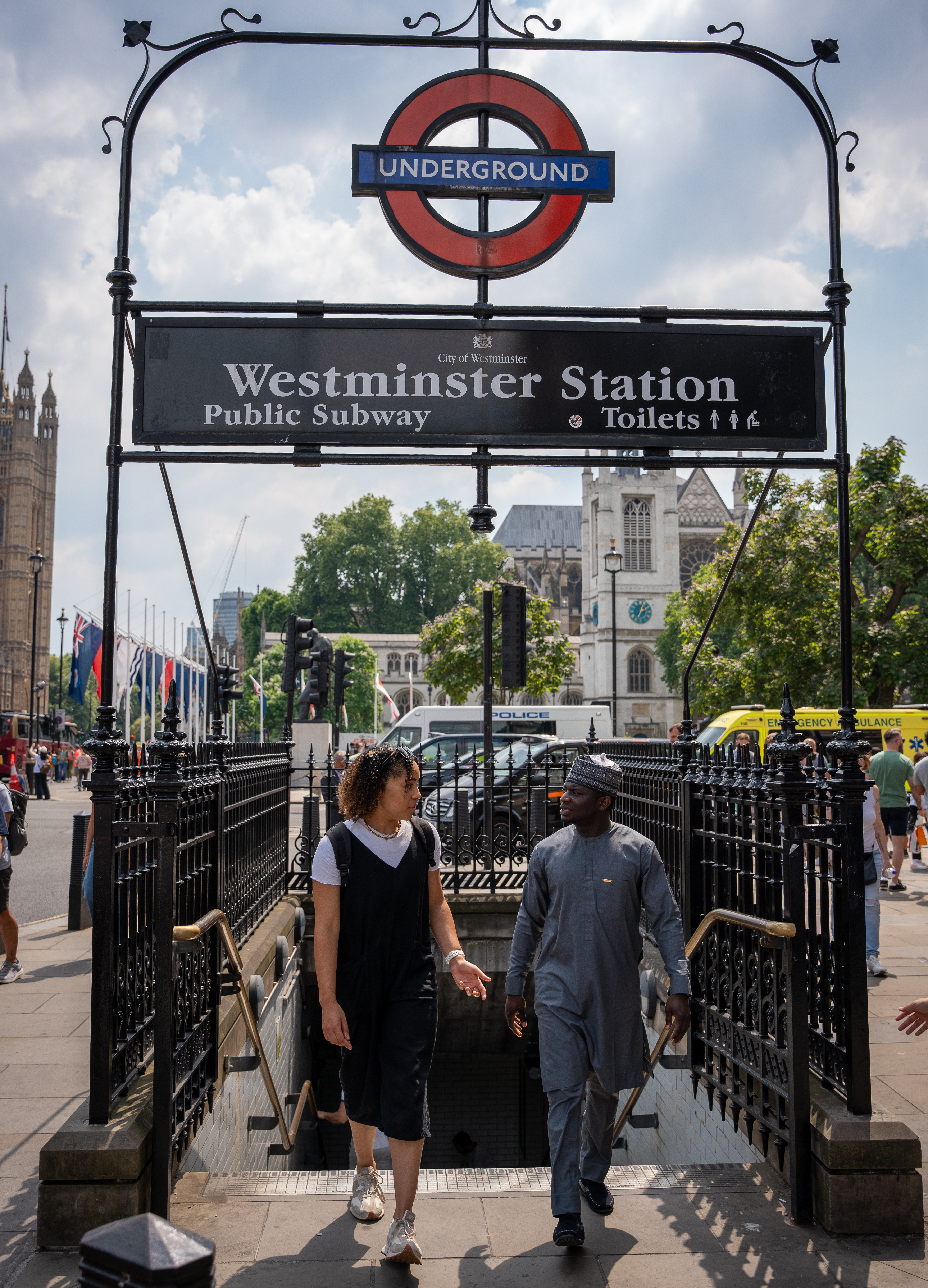 2 students walking out from Westminster tube station.