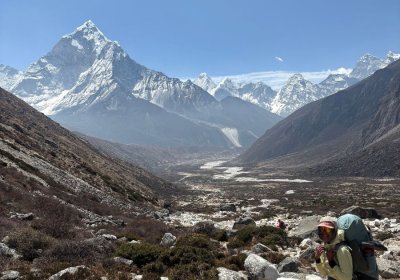 Student hiking through the mountains.